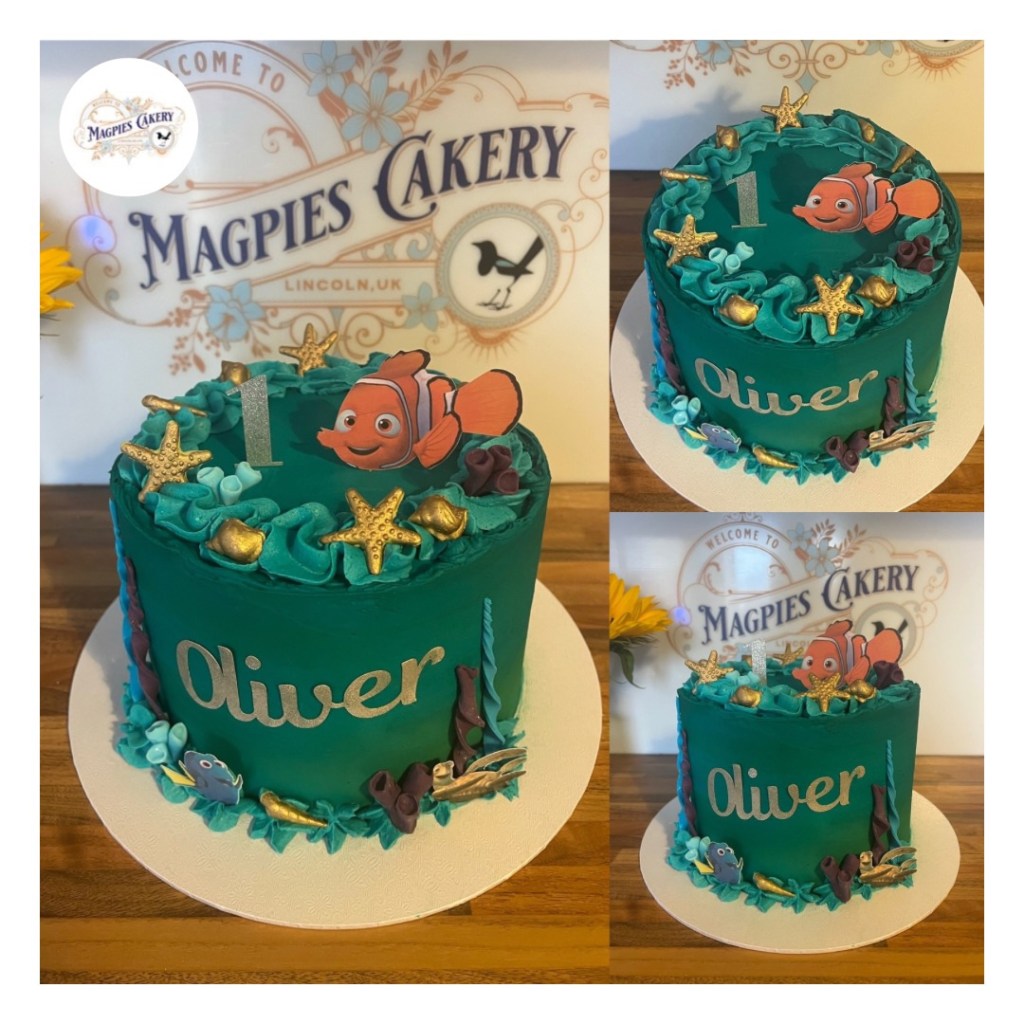 Tall 8” full buttercream finish Nemo inspired under the sea 1st birthday cake finished with green and blue buttercream, piping, fondant seashells and personalised cake toppers Magpies Cakery, cake maker & decorator, Lincoln & Newark