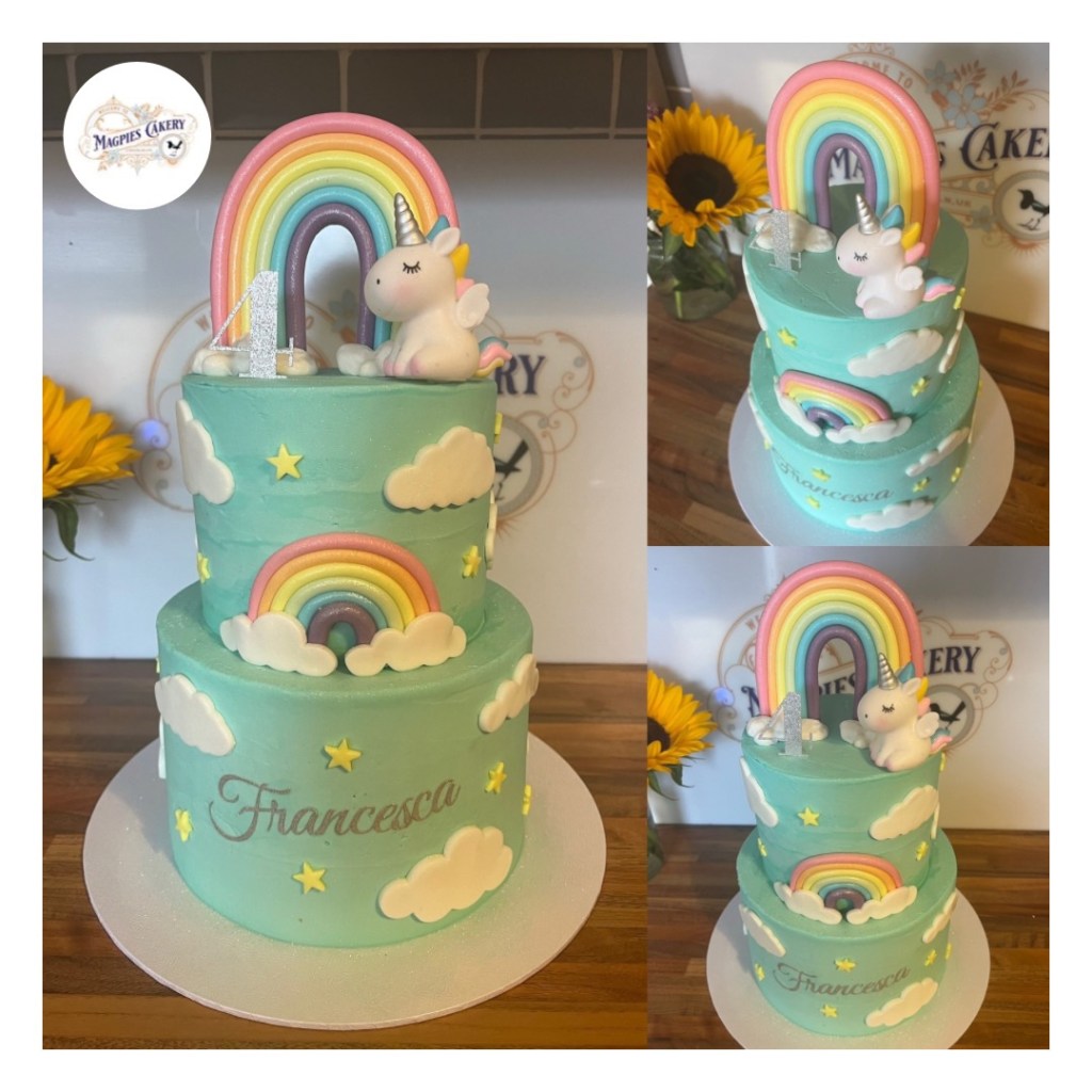 Two tier, tall 8” & 6” full buttercream finish unicorn & rainbows inspired 4th birthday cake. Finished with sky blue buttercream, fondant rainbows, stars & clouds and personalised cake toppers Magpies Cakery, cake maker & decorator, Lincoln & Newark