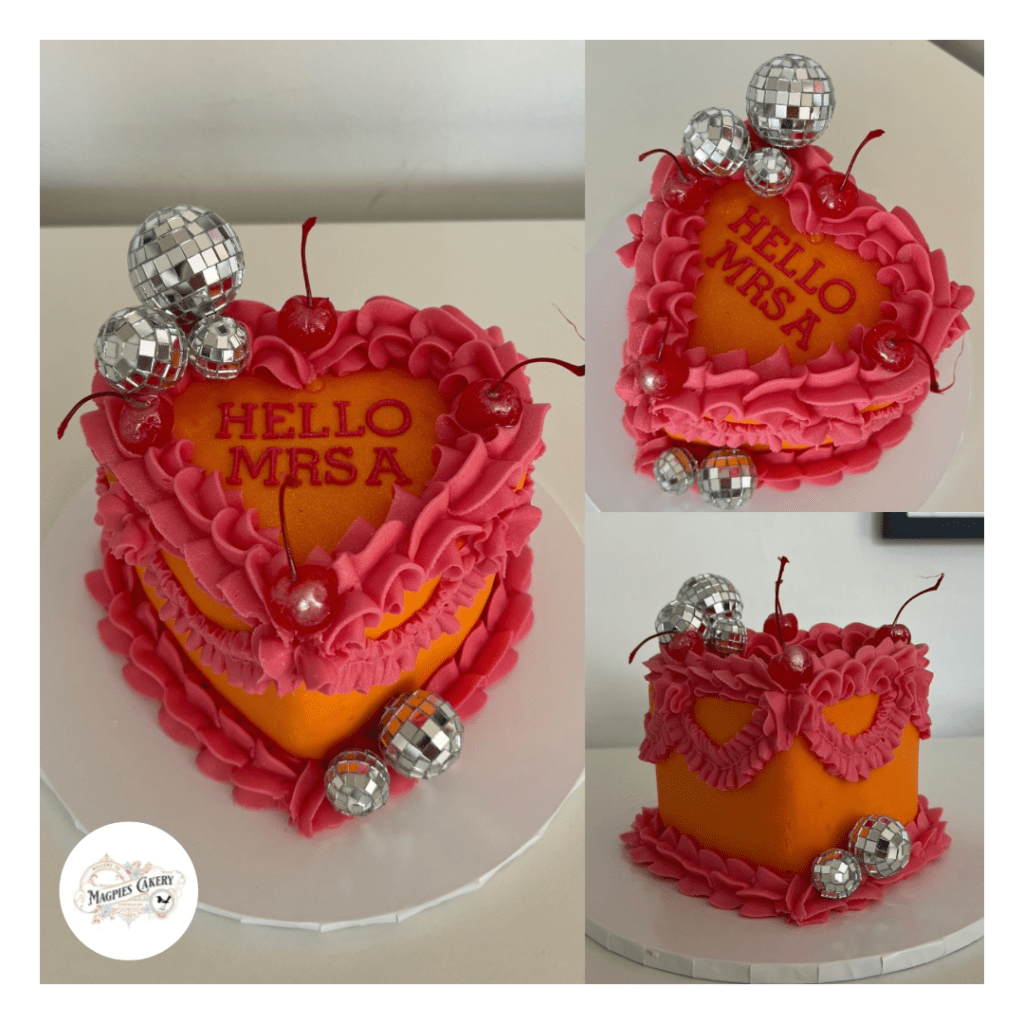 Vintage style heart buttercream finish hen do cake. Magpies Cakery, cake maker & decorator, Lincoln & Newark UK